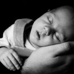 sleeping_baby_on_a_hand_199952-Copy-300x200